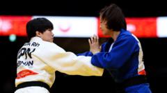 China's Tang disqualified after alleged bite