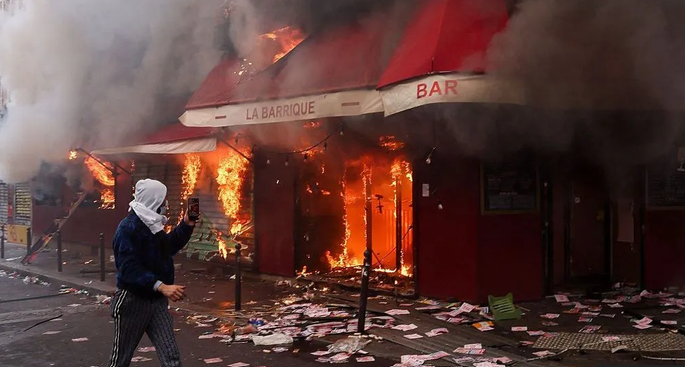 Violent clashes, looting and buildings ablaze in France as more than 1,200 arrested after protests