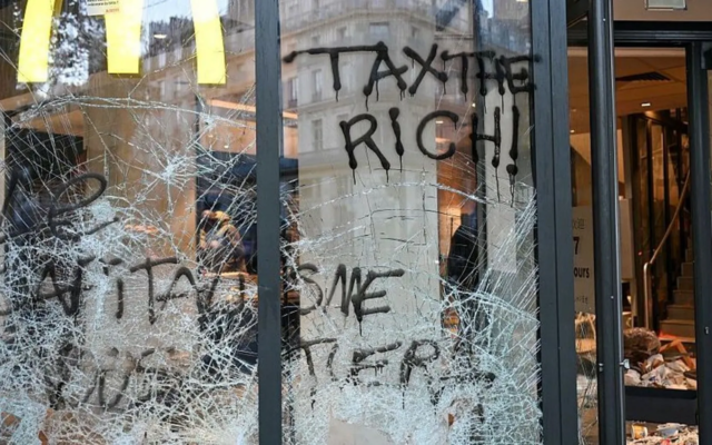 Burnt out cars and shattered glass on Paris streets after protests turn to riots and looting