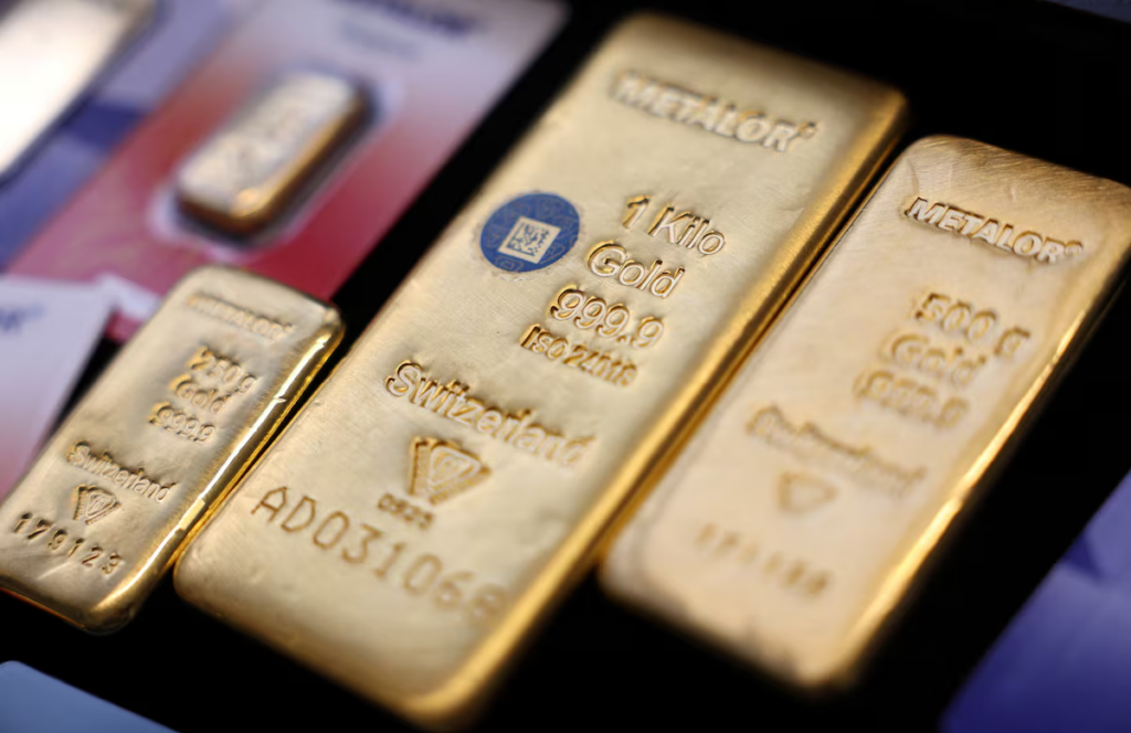Gold edges higher on softer oil; Fed rate outlook in focus