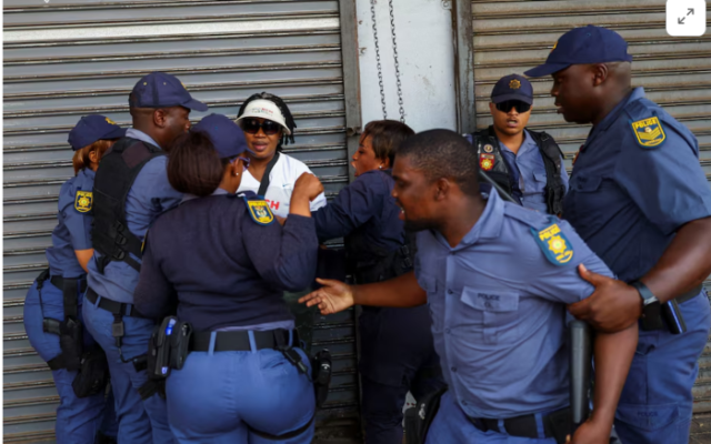 South African police investigate killing of foreign national by crowd